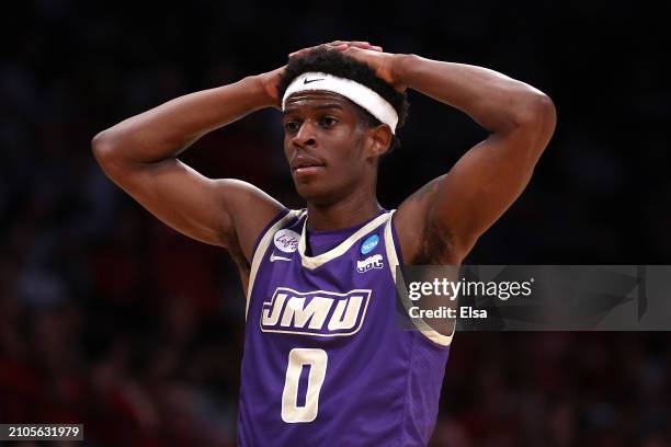 Xavier Brown of the James Madison Dukes reacts during the first half against the Wisconsin Badgers in the first round of the NCAA Men's Basketball...