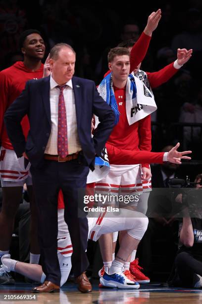 Head coach Greg Gard of the Wisconsin Badgers and the bench react during the second half against the James Madison Dukes in the first round of the...