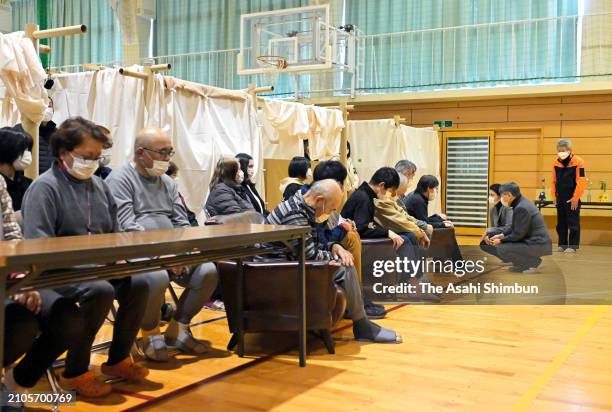 Emperor Naruhito and Empress Masako talk with evacuees at Midorigaoka Junior High School where evacuees take shelter after the Noto Peninsula...