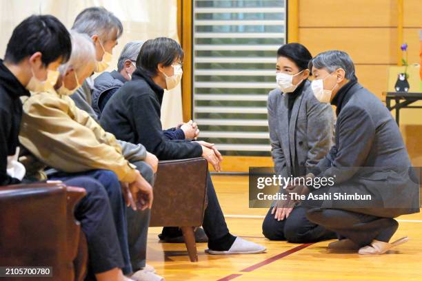Emperor Naruhito and Empress Masako talk with evacuees at Midorigaoka Junior High School where evacuees take shelter after the Noto Peninsula...