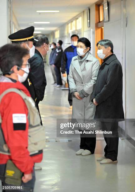 Emperor Naruhito and Empress Masako talk with volunteers, police officers and fire company chief after the Noto Peninsula Earthquakes on March 22,...