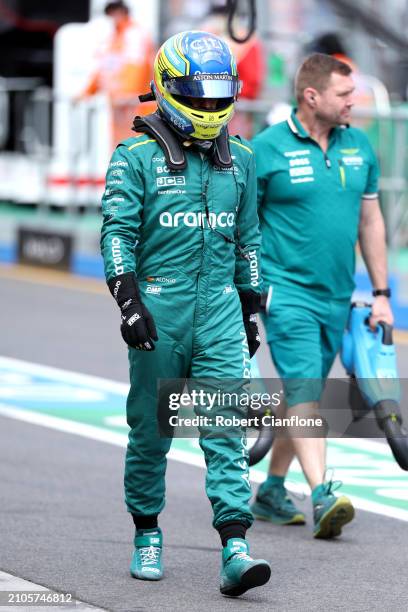Fernando Alonso of Spain and Aston Martin F1 Team walks in the Pitlane during final practice ahead of the F1 Grand Prix of Australia at Albert Park...