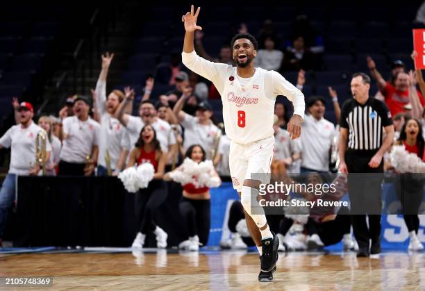 Mylik Wilson of the Houston Cougars celebrates a basket by his teammate during the second half against the Longwood Lancers in the first round of the...