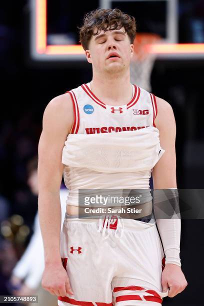 Max Klesmit of the Wisconsin Badgers reacts after losing to James Madison Dukes 72-61 in the first round of the NCAA Men's Basketball Tournament at...