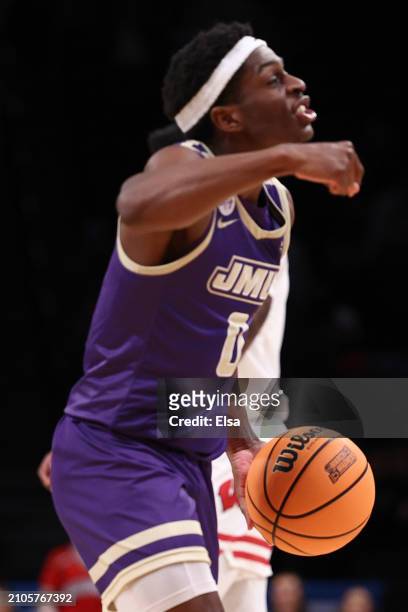 Xavier Brown of the James Madison Dukes celebrates after defeating the Wisconsin Badgers 72-61 in the first round of the NCAA Men's Basketball...