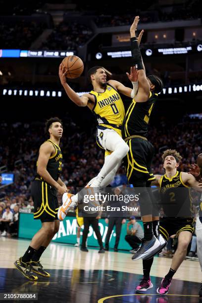 Tyrese Haliburton of the Indiana Pacers goes up for a shot on Moses Moody of the Golden State Warriors in the second half at Chase Center on March...