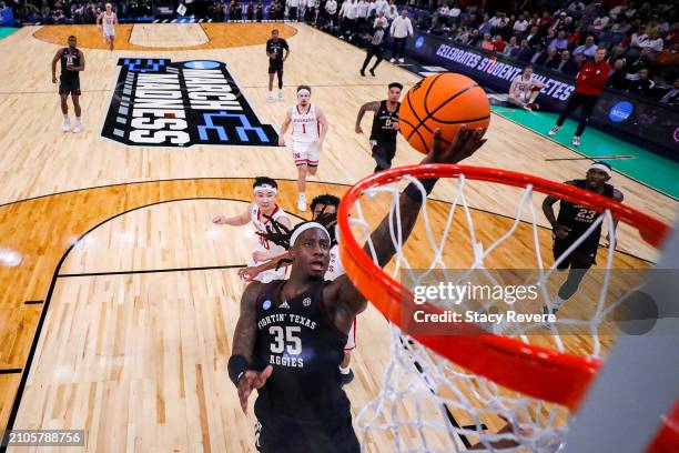 Manny Obaseki of the Texas A&M Aggies attempts a shot against the Nebraska Cornhuskers during the first half in the first round of the NCAA Men's...