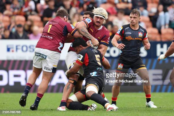 Pari Pari Parkinson of the Highlanders is tackled during the round five Super Rugby Pacific match between Chiefs and Highlanders at FMG Stadium...