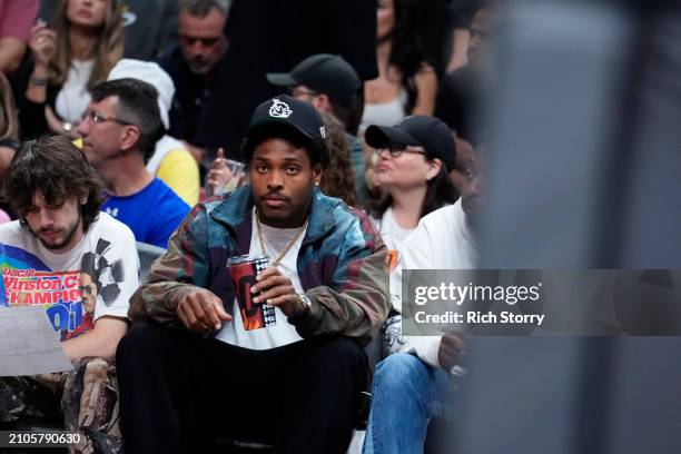 Jaylen Ramsey of the Miami Dolphins watches a game between the Miami Heat and the New Orleans Pelicans at Kaseya Center on March 22, 2024 in Miami,...