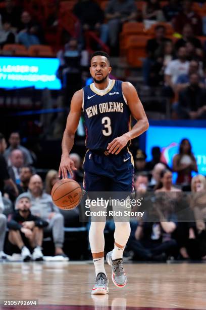 McCollum of the New Orleans Pelicans dribbles the ball up the court against the Miami Heat during the third quarter at Kaseya Center on March 22,...