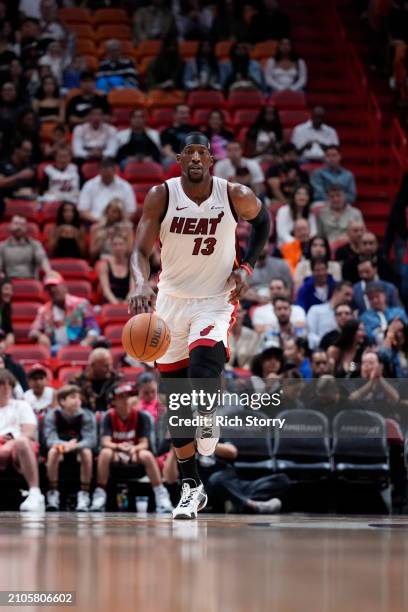 Bam Adebayo of the Miami Heat dribbles the ball up the court against the New Orleans Pelicans during the first quarter at Kaseya Center on March 22,...