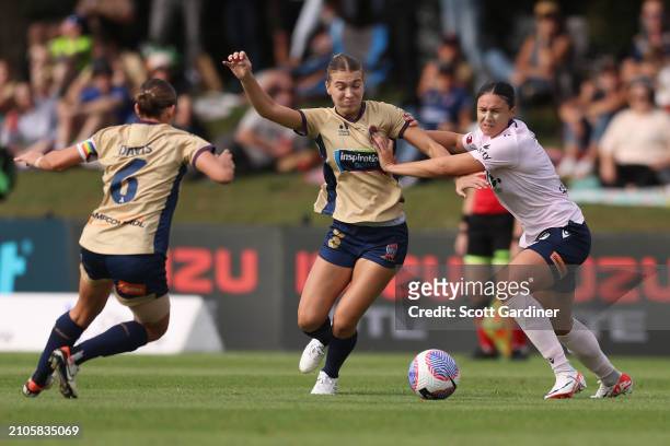 Claudia Cicco of the Jets competes for the ball with Emily Gielnik of the Victoryduring the A-League Women round 21 match between Newcastle Jets and...