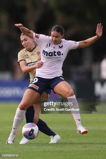 Emily Gielnik of the Victory competes for the ball with Claudia Cicco of the Jets during the A-League Women round 21 match between Newcastle Jets and...