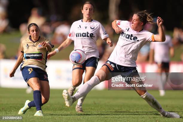 Melindaj Barbieri of the Jets kicks the ball as Kayla Morrison of the Victory defends during the A-League Women round 21 match between Newcastle Jets...