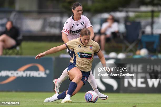Natasha Prior of the Jets competes for the ball with Emily Gielnik of the Victory during the A-League Women round 21 match between Newcastle Jets and...