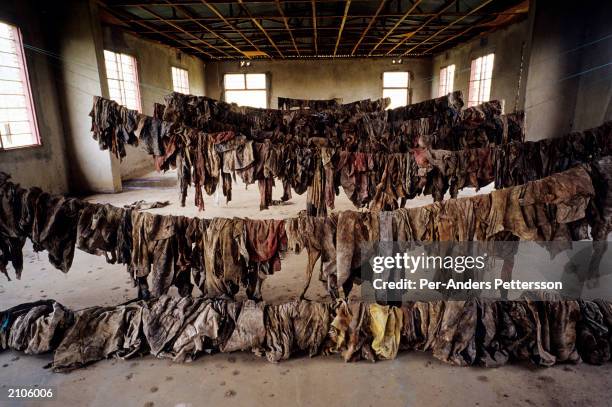 Clothes of victims of the Rwandan genocide are on display at the Murambi memorial site February 23, 2003 in Murambi outside Gikongoro, Rwanda. 10,000...