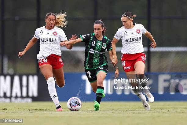 Stacey Papadopoulos of Western United runs the ball under pressure from Maliah Morris and Olivia Price of the Wanderers during the A-League Women...