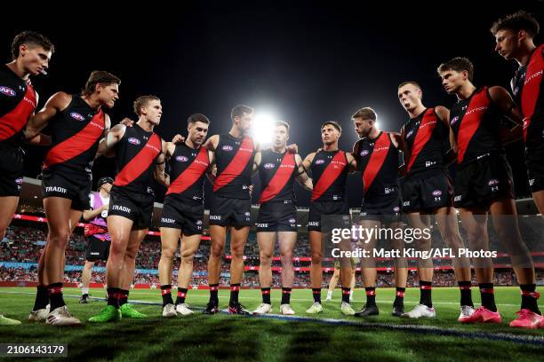 Zach Merrett of the Bombers talks to team mates in a huddle during the round two AFL match between Sydney Swans and Essendon Bombers at SCG, on March...