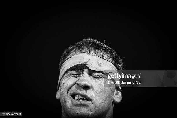 Dale Finucane of the Sharks walks off after receiving a cut during the round three NRL match between Wests Tigers and Cronulla Sharks at Leichhardt...