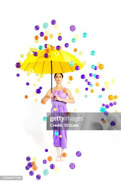 colorful balls are raining from the sky. beautiful ballerina is protected from colorful balls with her japanese umbrella. - 101cats stock pictures, royalty-free photos & images