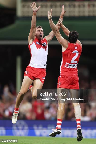 Will Hayward of the Swans celebrates with team mates after kicking a goal during the round two AFL match between Sydney Swans and Essendon Bombers at...