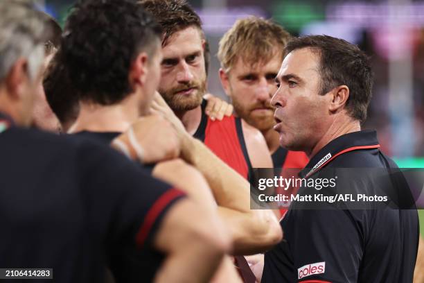 Bombers head coach Brad Scott speaks to players at three quarter time during the round two AFL match between Sydney Swans and Essendon Bombers at...