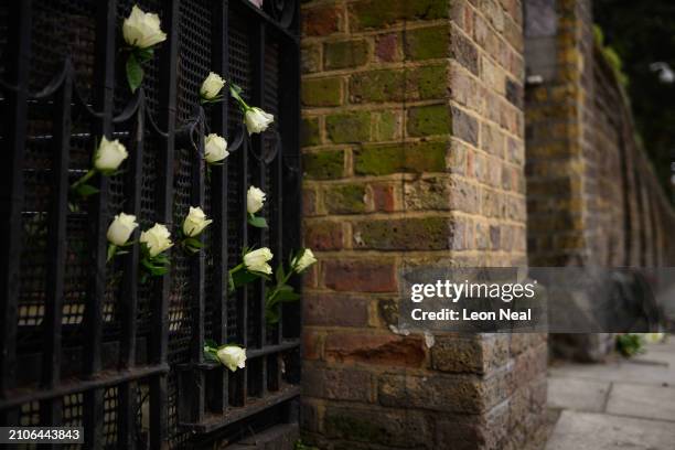 Flowers placed for those killed in the attacks on the Crocus City Hall near Moscow are seen outside the Embassy of Russia, on March 23, 2024 in...