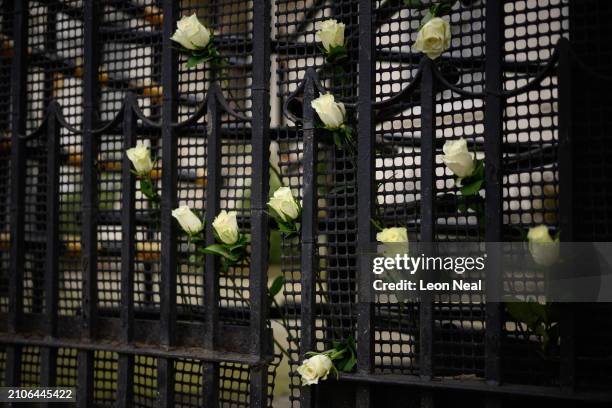 Flowers placed for those killed in the attacks on the Crocus City Hall near Moscow are seen outside the Embassy of Russia, on March 23, 2024 in...