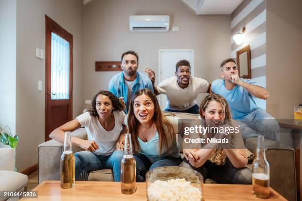 friends gathering at home for a relaxing evening together - group video conference stock pictures, royalty-free photos & images