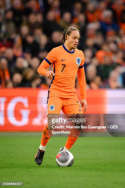 Xavi Simons of the Netherlands controls the ball during the friendly match between Netherlands and Scotland at Johan Cruyff Arena on March 22, 2024...