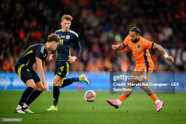 Memphis Depay of the Netherlands is tackled by Jack Hendry of Scotland during the friendly match between Netherlands and Scotland at Johan Cruyff...