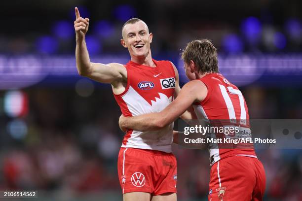Chad Warner of the Swans celebrates with team mates after kicking a goal during the round two AFL match between Sydney Swans and Essendon Bombers at...