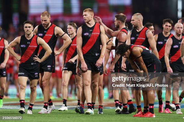 Peter Wright of the Bombers and team mates look dejected after the round two AFL match between Sydney Swans and Essendon Bombers at SCG, on March 23...