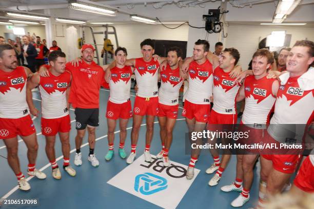 Swans players sing the club song in the changing rooms after victory during the round two AFL match between Sydney Swans and Essendon Bombers at SCG,...