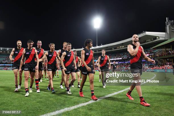 Bombers players look dejected after the round two AFL match between Sydney Swans and Essendon Bombers at SCG, on March 23 in Sydney, Australia.