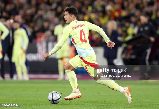 Martin Zubimendl of Spain runs with the ball during the international friendly match between Spain and Colombia at London Stadium on March 22, 2024...