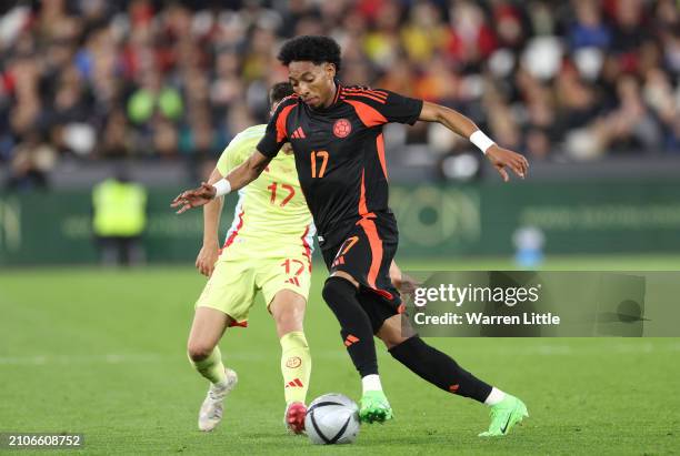 Johan Mojica of Columbia runs with the ball during the international friendly match between Spain and Colombia at London Stadium on March 22, 2024 in...