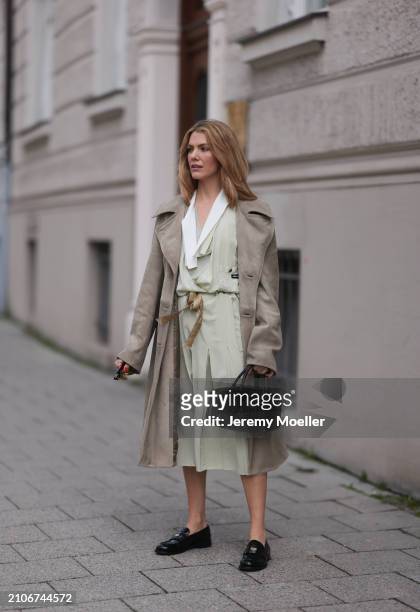 Viviane Geppert seen wearing Miu Miu gold / black sunglasses, Miu Miu pastel green flattered midi dress, Miu Miu beige / brown trenchcoat / long...