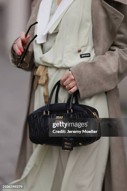 Viviane Geppert seen wearing Miu Miu gold / black sunglasses, Miu Miu pastel green flattered midi dress, Miu Miu beige / brown trenchcoat / long coat...