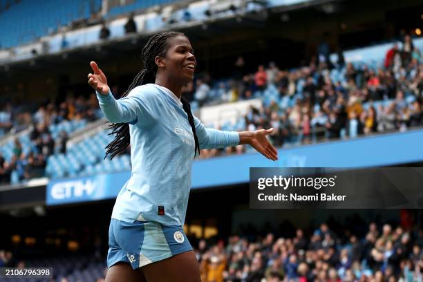 Khadija Shaw of Manchester City celebrates scoring her team's third goal during the Barclays Women's Super League match between Manchester City and...