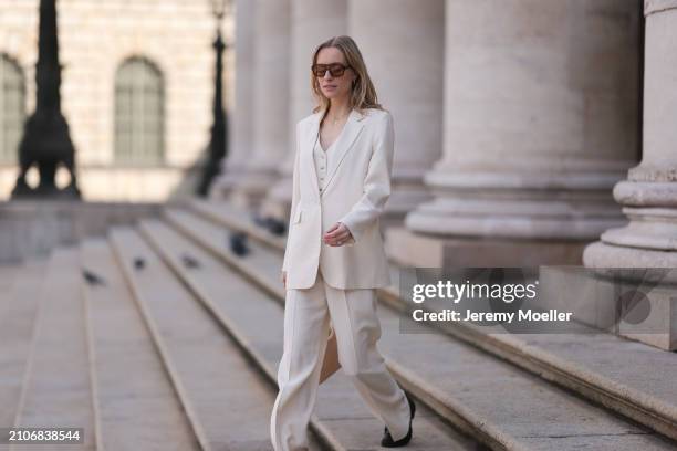 Marlies Pia Pfeifhofer seen wearing Vehla Eyewear black / brown sunglasses, gold necklace, Cinque creamy white suit vest, Cinque creamy white elegant...