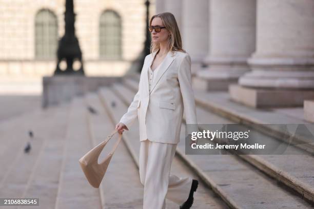 Marlies Pia Pfeifhofer seen wearing Vehla Eyewear black / brown sunglasses, gold necklace, Cinque creamy white suit vest, Cinque creamy white elegant...
