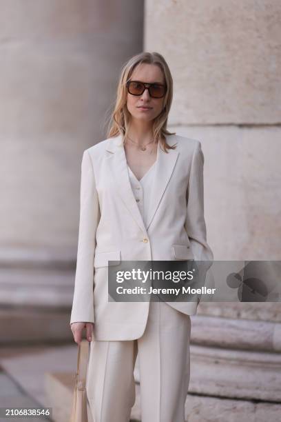 Marlies Pia Pfeifhofer seen wearing Vehla Eyewear black / brown sunglasses, gold necklace, Cinque creamy white suit vest, Cinque creamy white elegant...