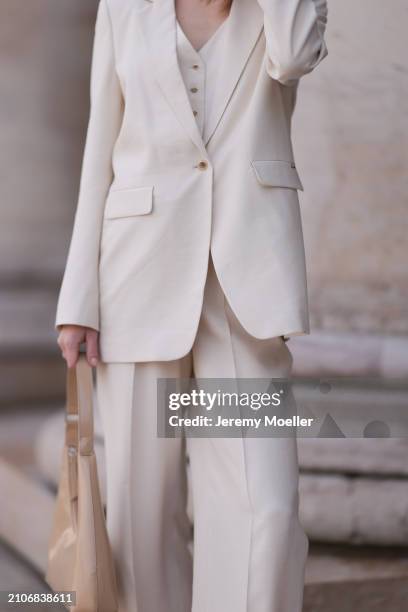 Marlies Pia Pfeifhofer seen wearing Cinque creamy white suit vest, Cinque creamy white elegant blazer, matching Cinque creamy white long suit pants,...