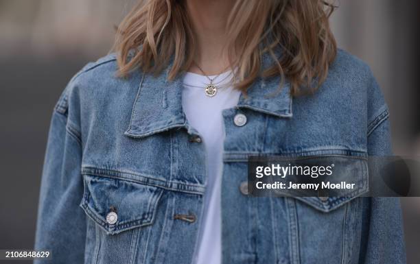 Marlies Pia Pfeifhofer seen wearing gold necklace, The Frankie Shop white cotton basic t-shirt and Agolde light blue denim short jeans jacket, on...