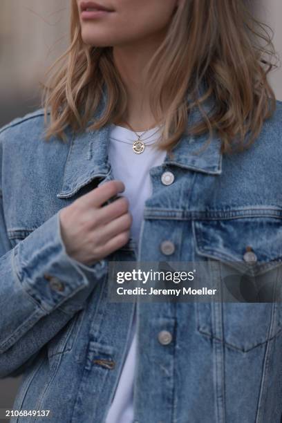 Marlies Pia Pfeifhofer seen wearing gold necklace, The Frankie Shop white cotton basic t-shirt and Agolde light blue denim short jeans jacket, on...