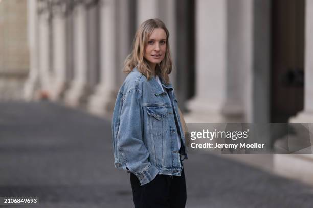 Marlies Pia Pfeifhofer seen wearing Agolde light blue denim short jeans jacket, Agolde black denim wide leg jeans pants, on March 22, 2024 in Munich,...