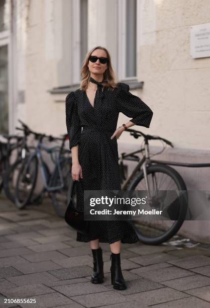 Marlies Pia Pfeifhofer seen wearing Ray-Ban black Wayfarer sunglasses, gold necklace and earrings, Adoore black with white dotty print pattern v-neck...