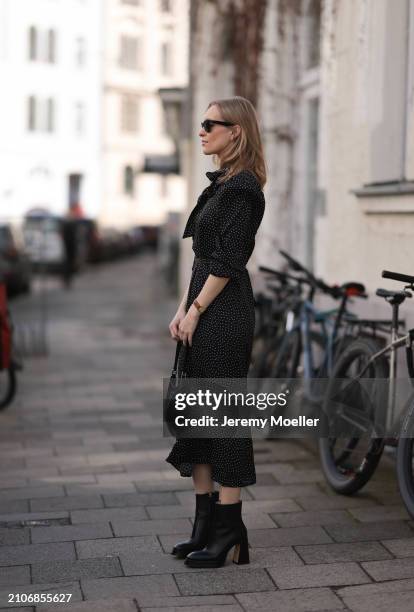 Marlies Pia Pfeifhofer seen wearing Ray-Ban black Wayfarer sunglasses, gold necklace and earrings, Adoore black with white dotty print pattern v-neck...