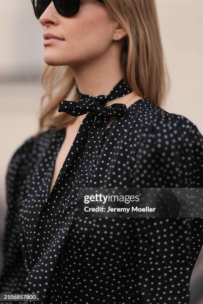 Marlies Pia Pfeifhofer seen wearing Ray-Ban black Wayfarer sunglasses, gold necklace and silver earrings, Adoore black with white dotty print pattern...